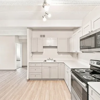 Julian Square Apartments kitchen wide view with stainless appliances