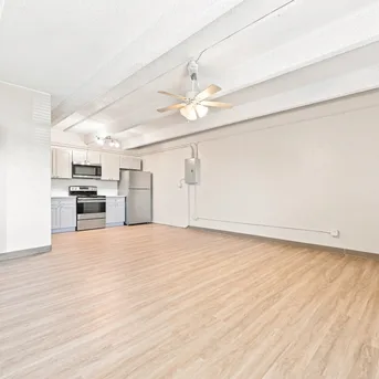 Julian Square Apartments open living area with wood-look flooring