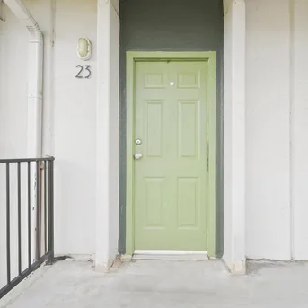 Julian Square Apartments front entrance with green door